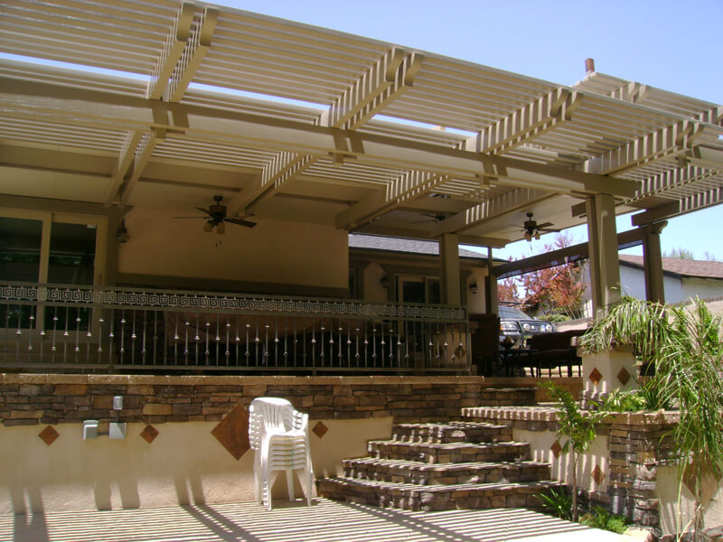 Residential outdoor patio area with a prominent pergola structure